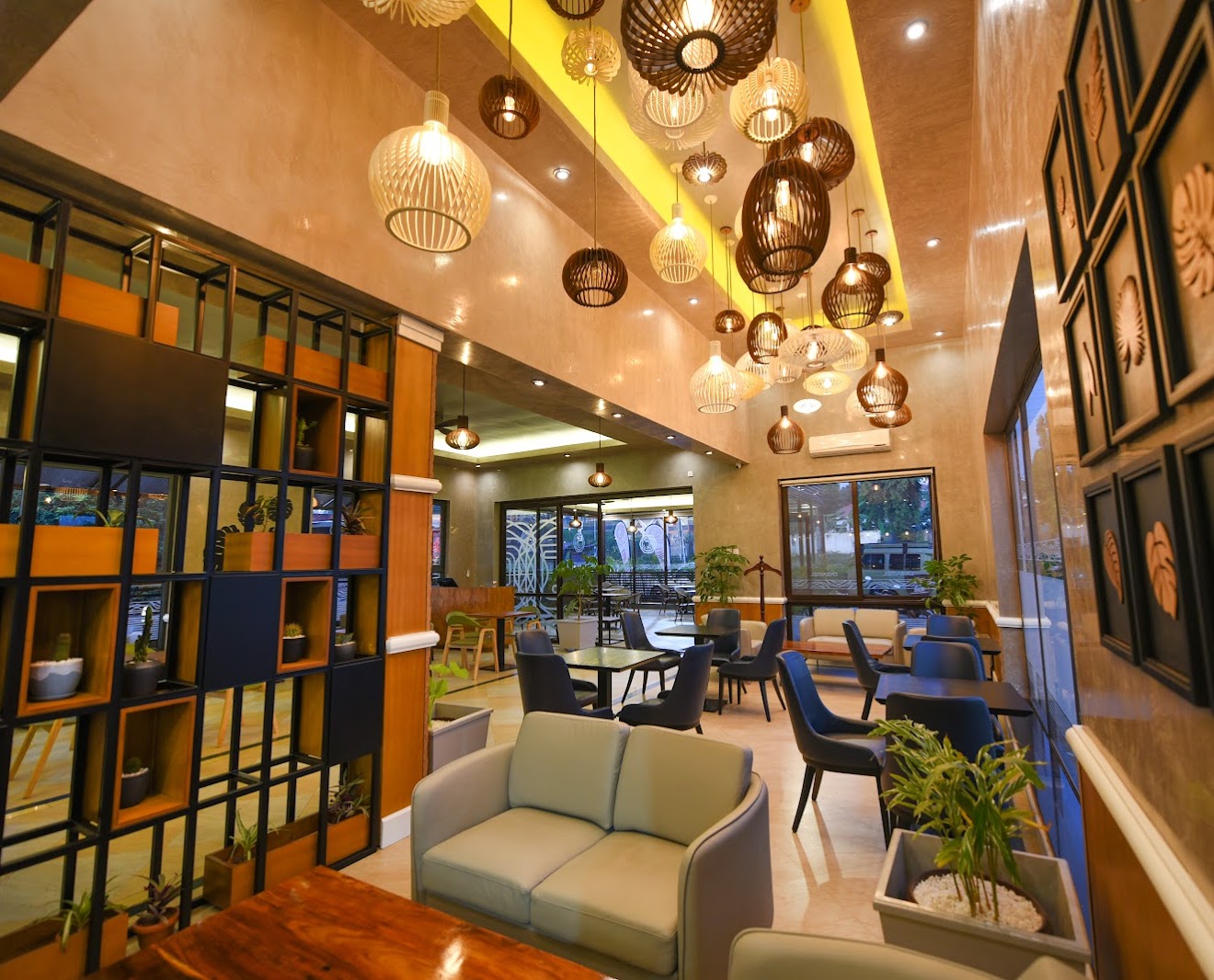 Caramel Café & Lounge interior with woven hanging lamps and comfortable seating